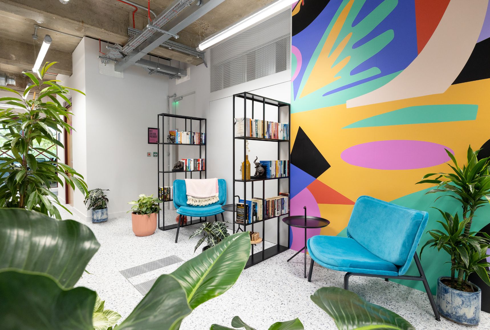 Welcoming Breakout space with mural at B Corp™ Runway East.