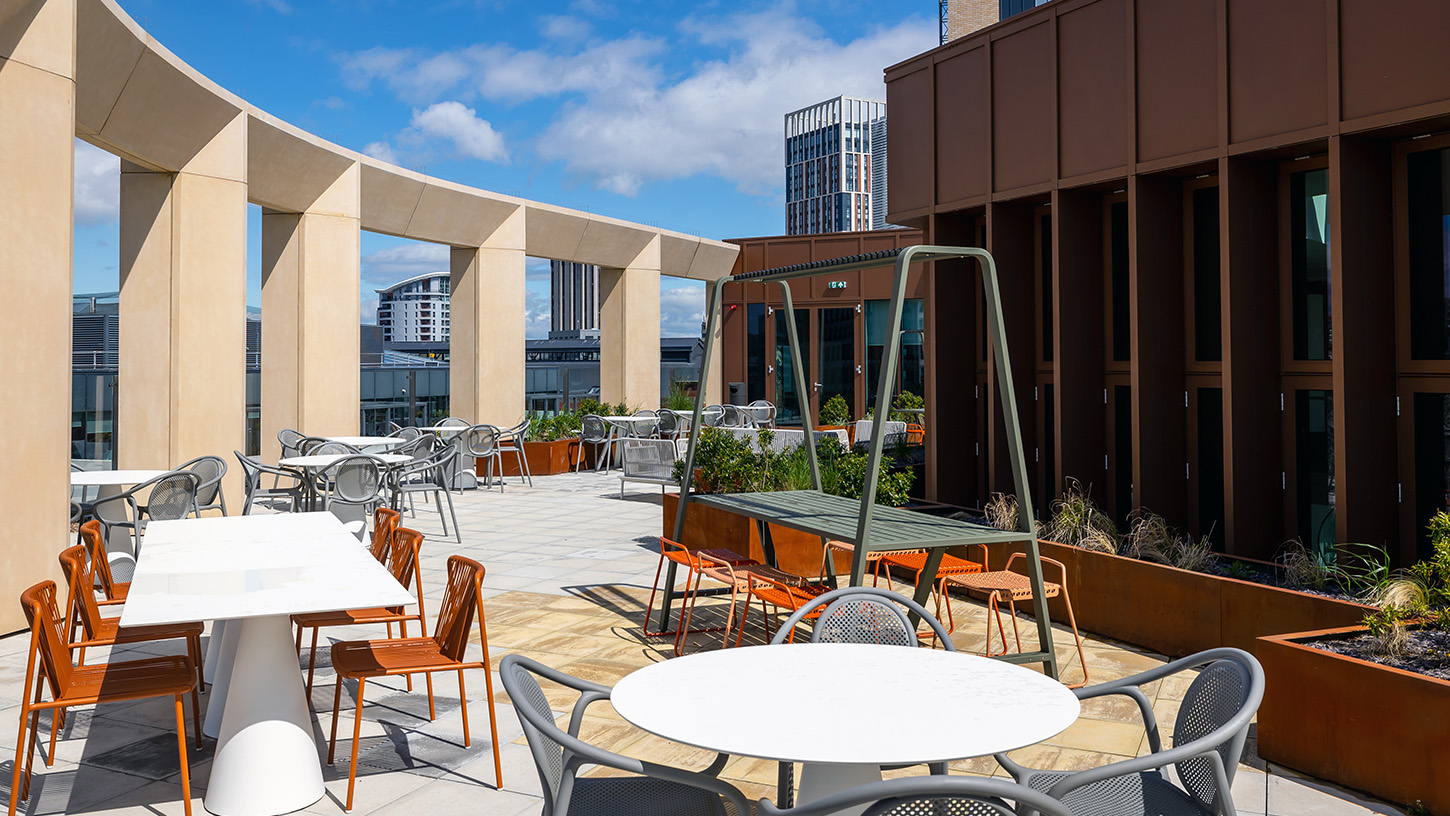 Osborne Clarke sunny roof terrace with tables and chairs, views over Bristol