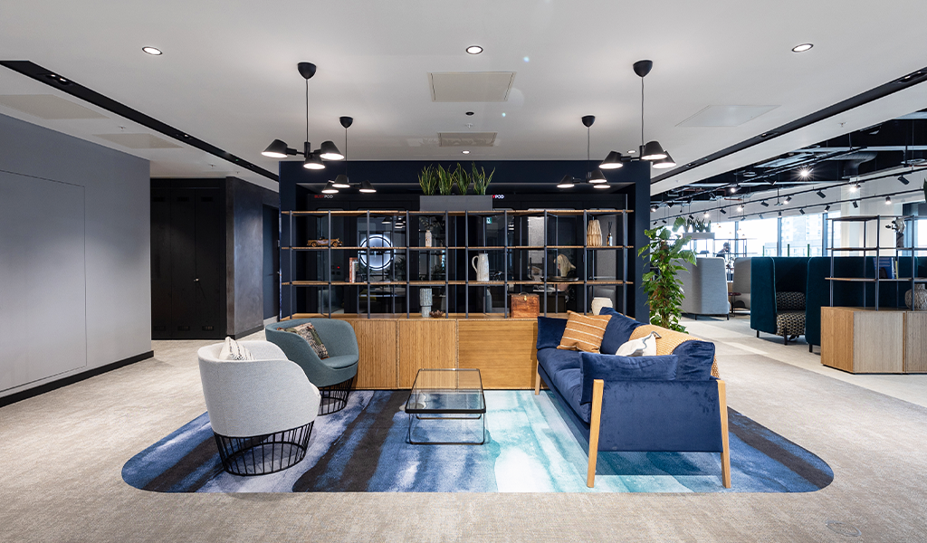 A welcoming lounge area of an office in navy accents