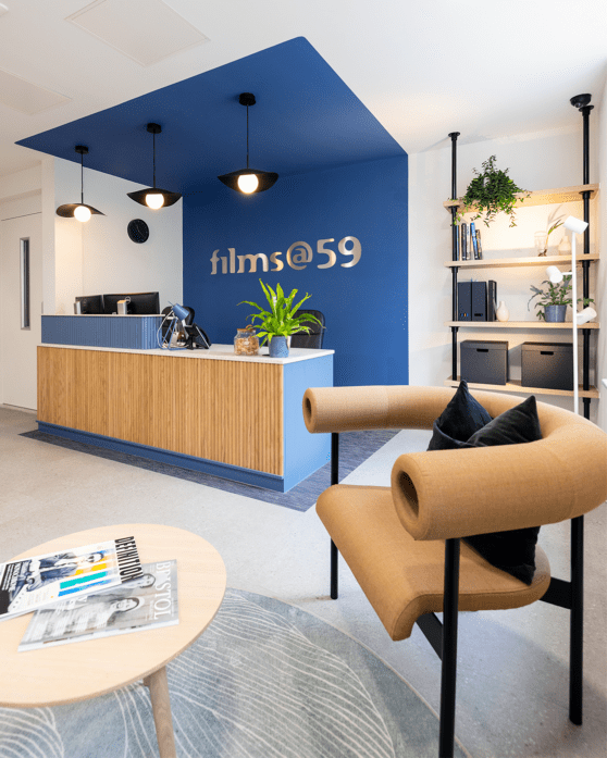 Office reception space with navy blue feature wall