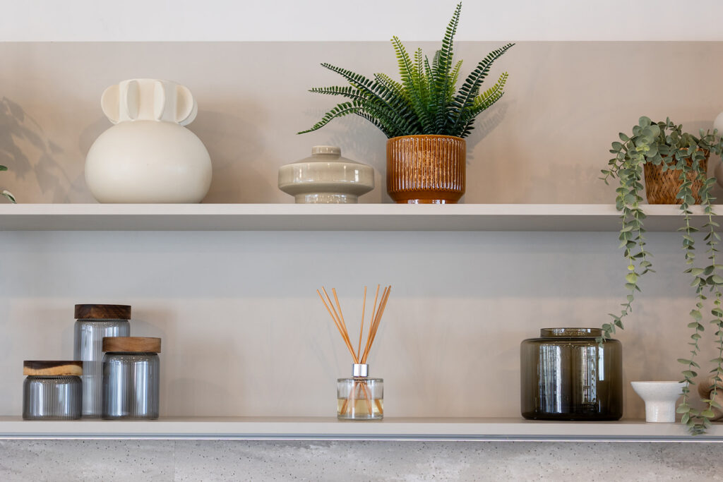 Office shelving with plants, books and tea and coffee