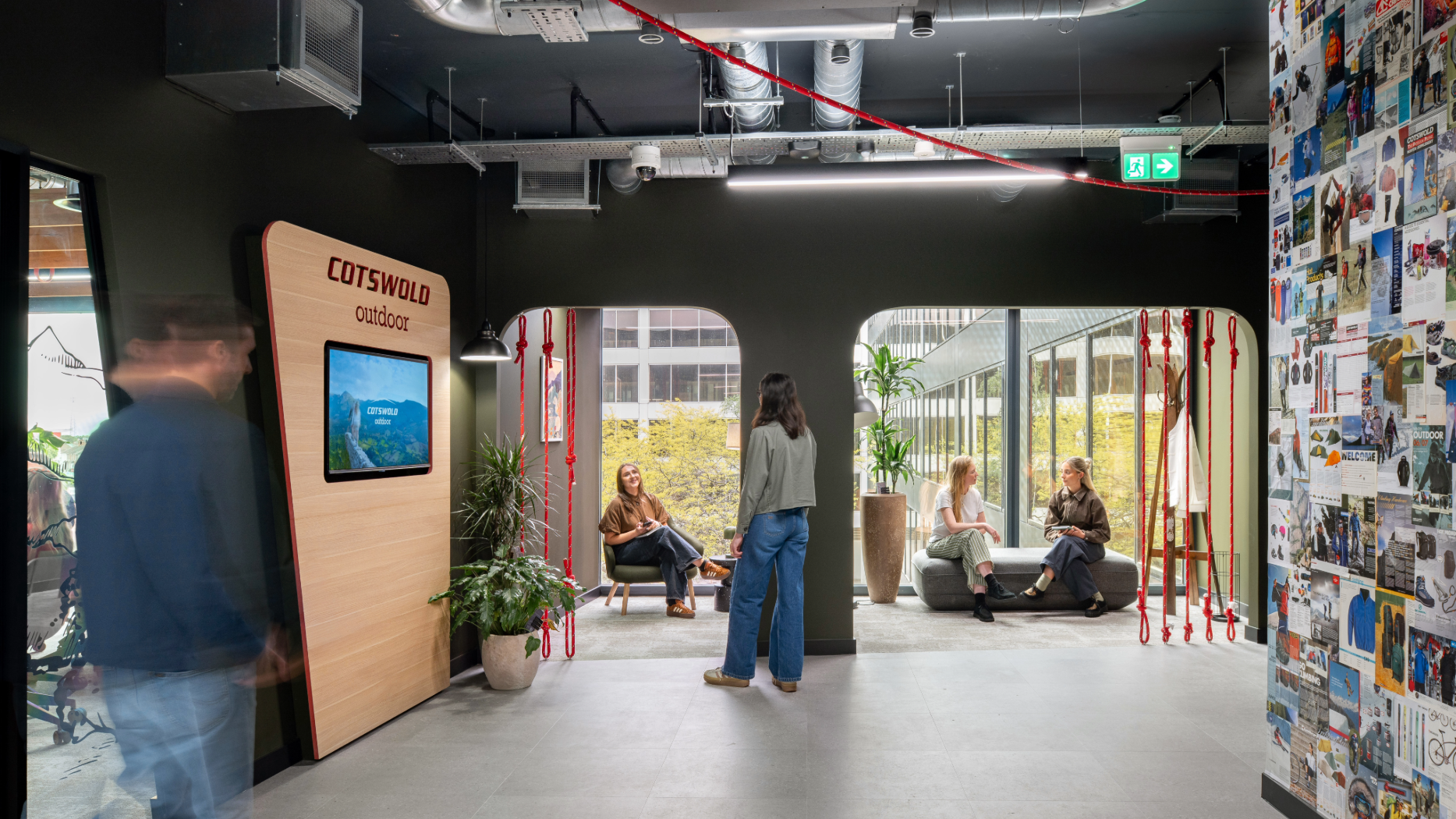 Cotswold Outdoor Group - Open space with collage wall, climbing ropes, and breakout spaces.